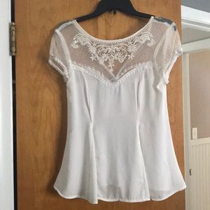 White silk top with lace.